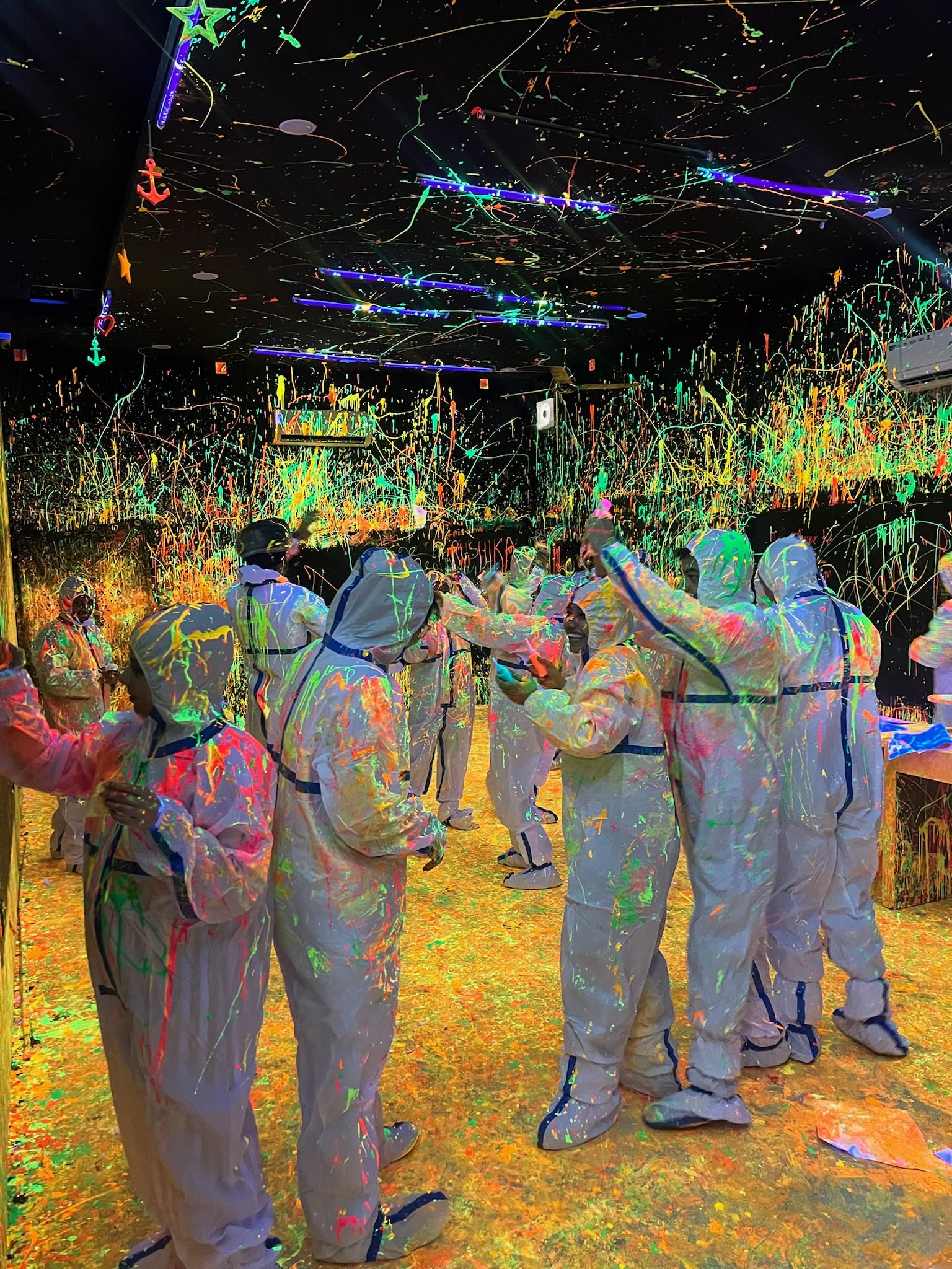 Buckets of UV-reactive glow paint at Splashit